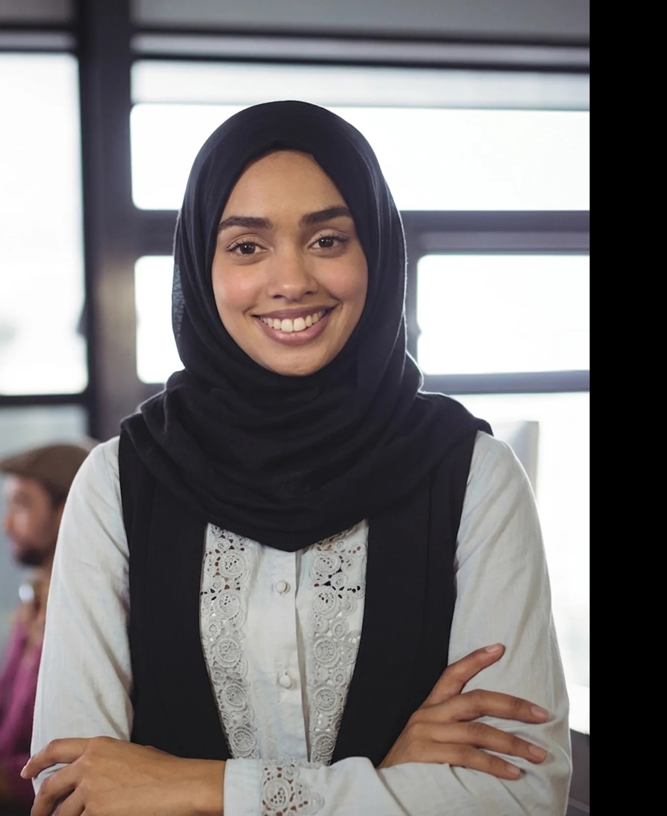 Professional smiling in workplace setting